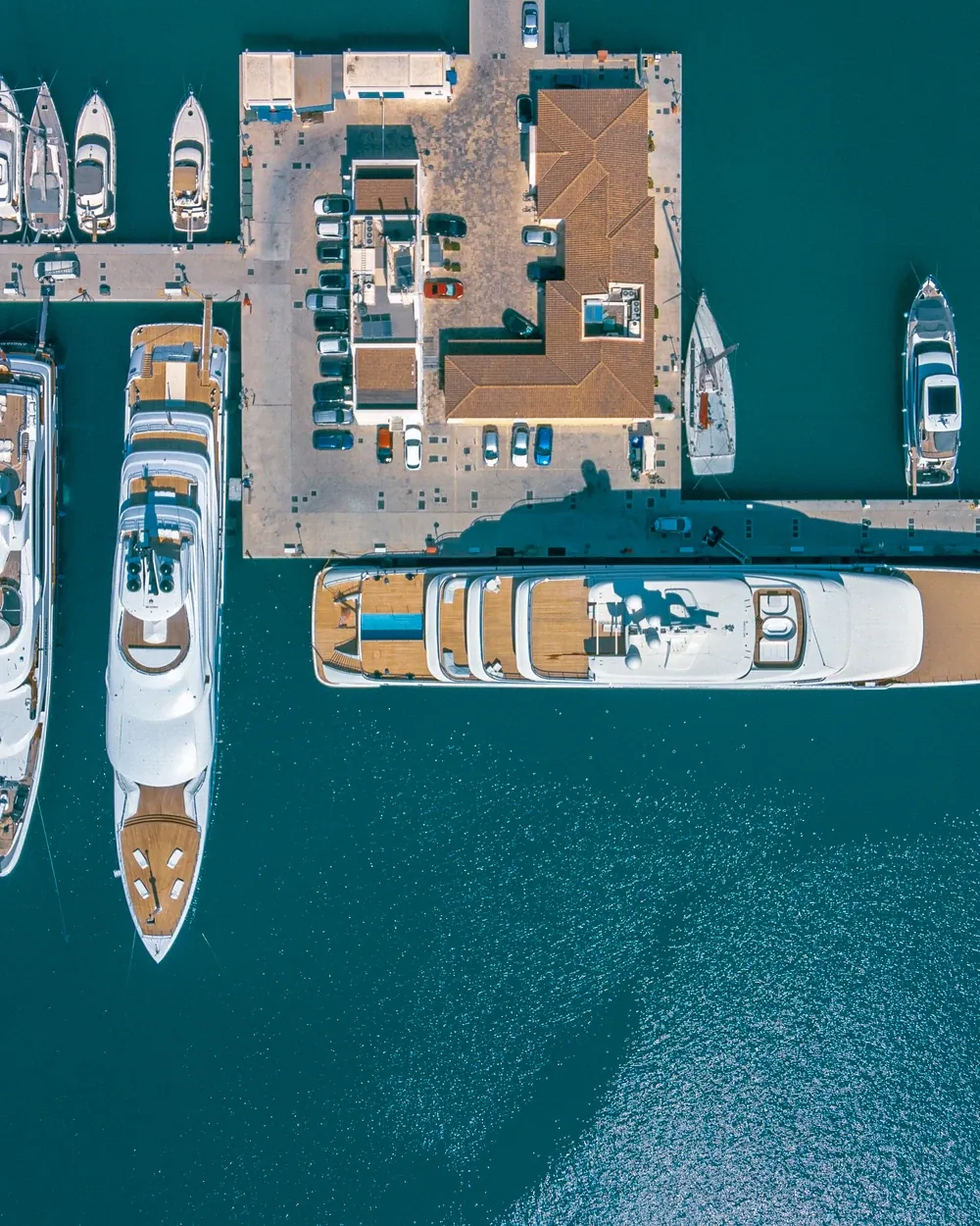 Aerial view of superyachts moored in a marina